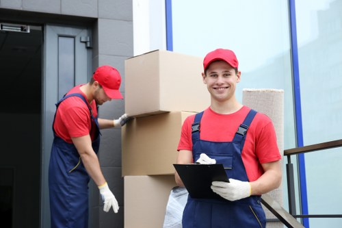 Removal team planning a furniture move in an Islington street