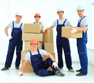 Removal van and moving boxes for a house move in Islington