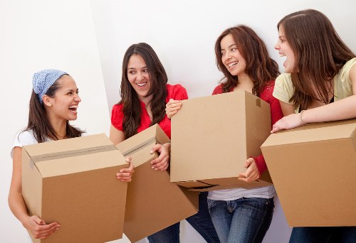 Office relocation team handling furniture in a commercial building
