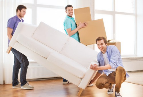 Local team collecting old sofas and beds from an Islington property