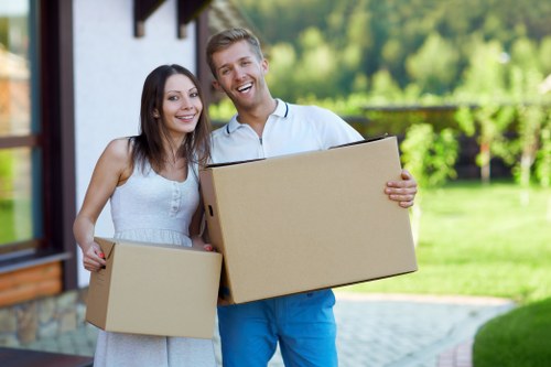 Professional movers handling household items in Islington