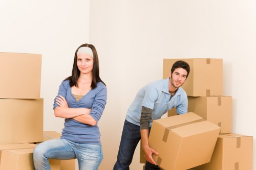 Unpacking boxes and arranging household items in a new Islington home