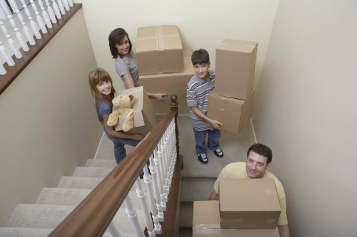 Helper carrying furniture for a local Islington move